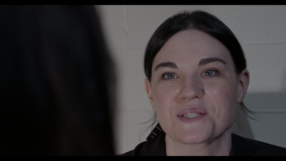 Emma, close, mid-conversation