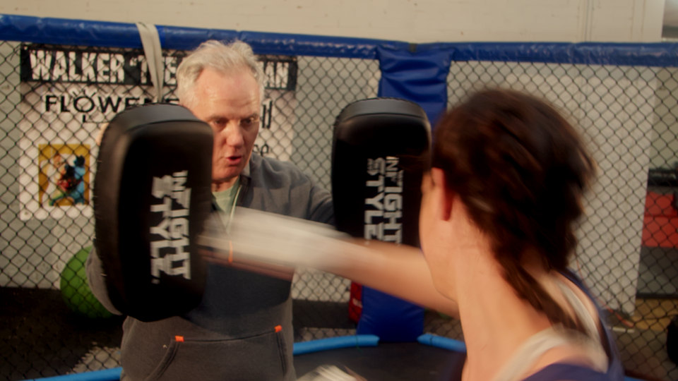 Pad work in the cage