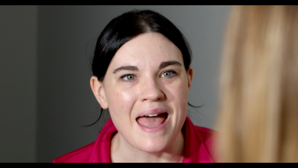 Emma, fired up, in the red polo